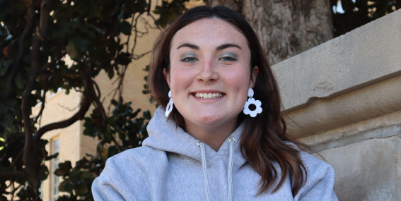 Student smiling to the camera.